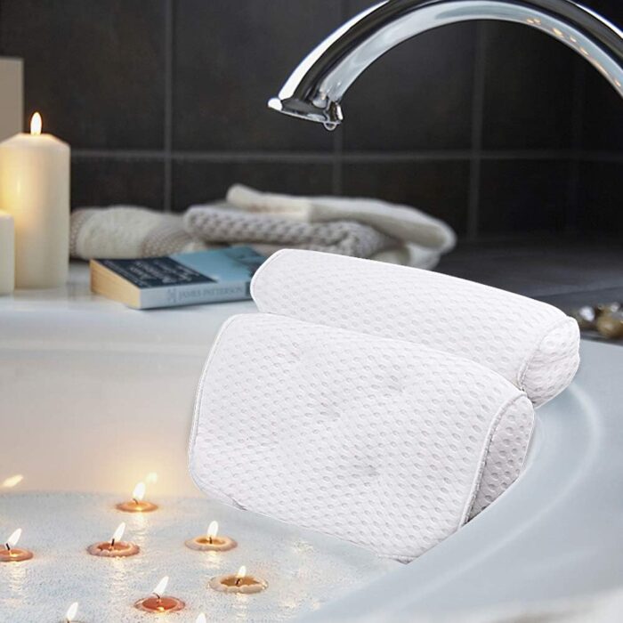 AmazeFan bath pillow with ergonomic design and soft mesh fabric, resting on the edge of a bathtub.