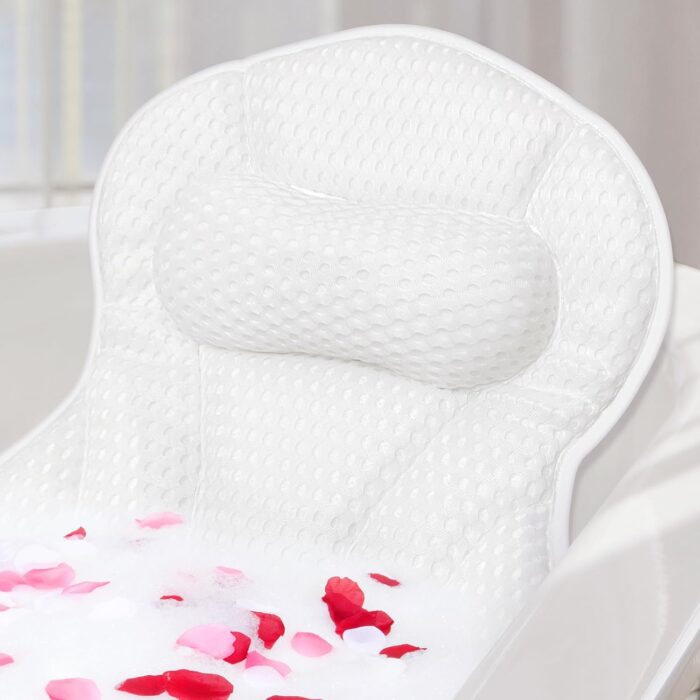 Luxury white bath pillow with soft padding, designed for head and neck support, attached to the side of a bathtub