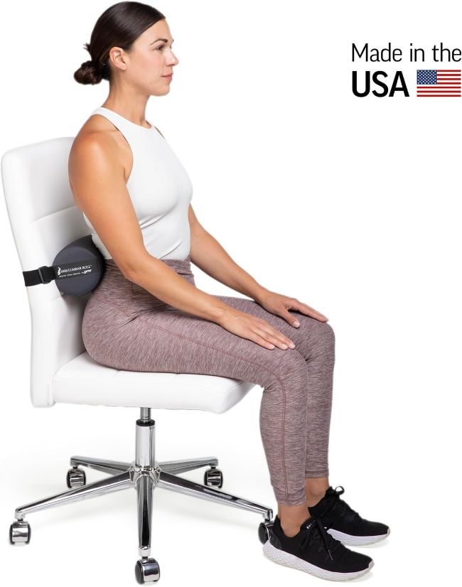 McKenzie Lumbar Roll positioned on an office chair to support the natural lower-back curve